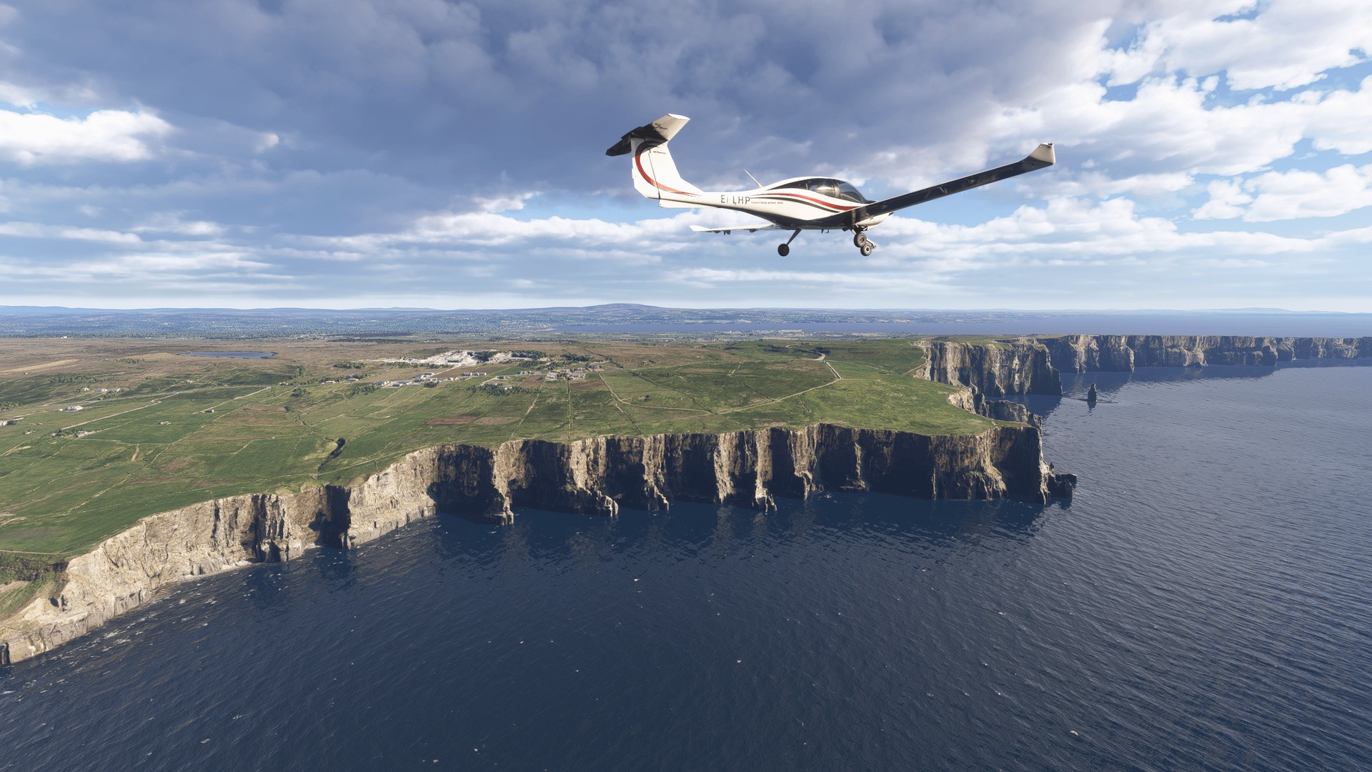 A light aircraft flying over green sea cliffs and blue water in Microsoft Flight Simulator 2024.