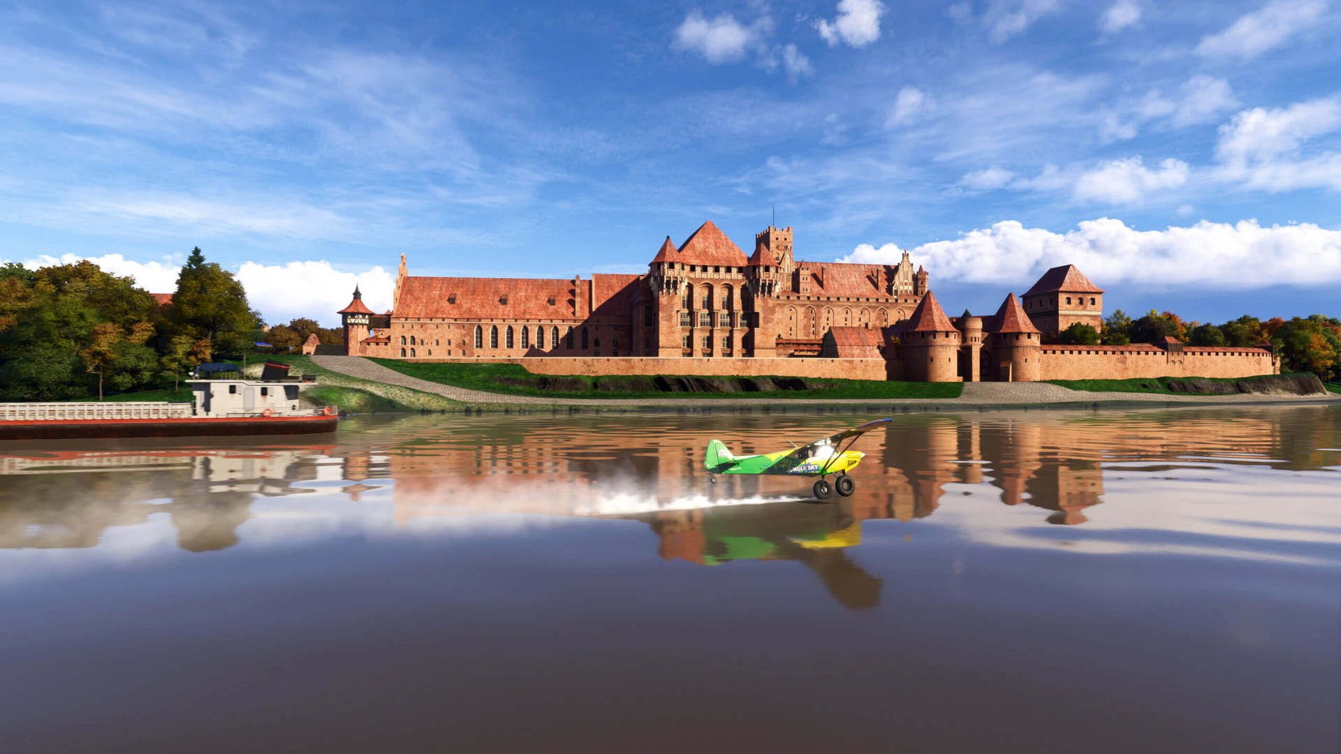 Malbork Castle's red-brick walls beside a river in Poland, in Microsoft Flight Simulator World Update 23
