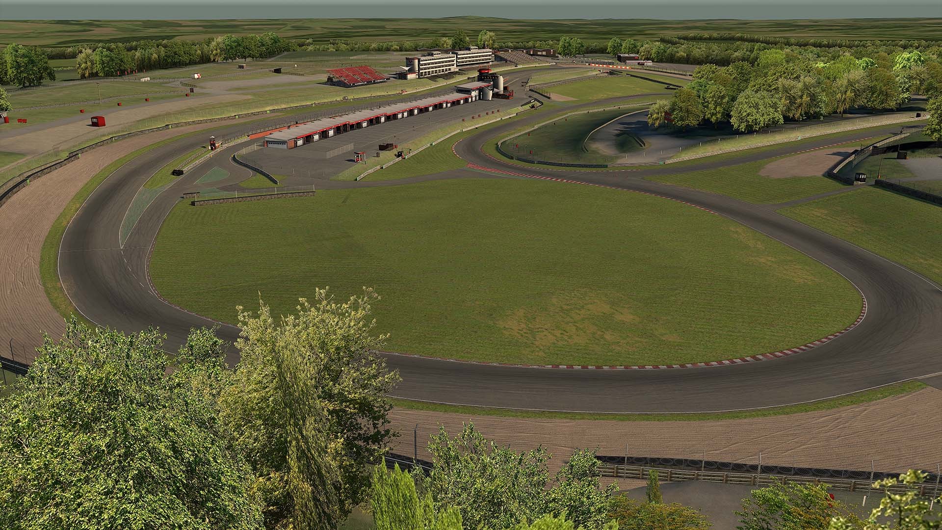 An aerial view of Brands Hatch's Indy circuit on iRacing, surrounded by trees