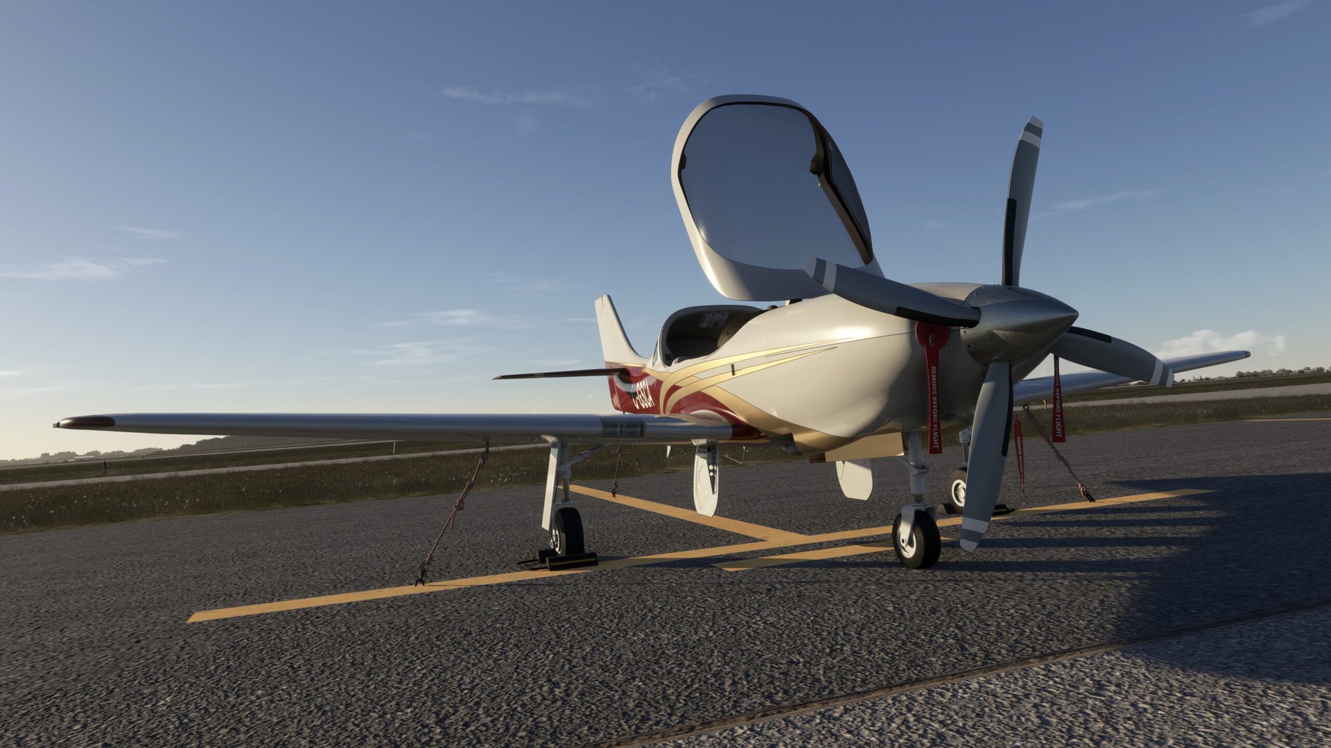 A Legacy RG550 parked with its one-piece canopy lifted open