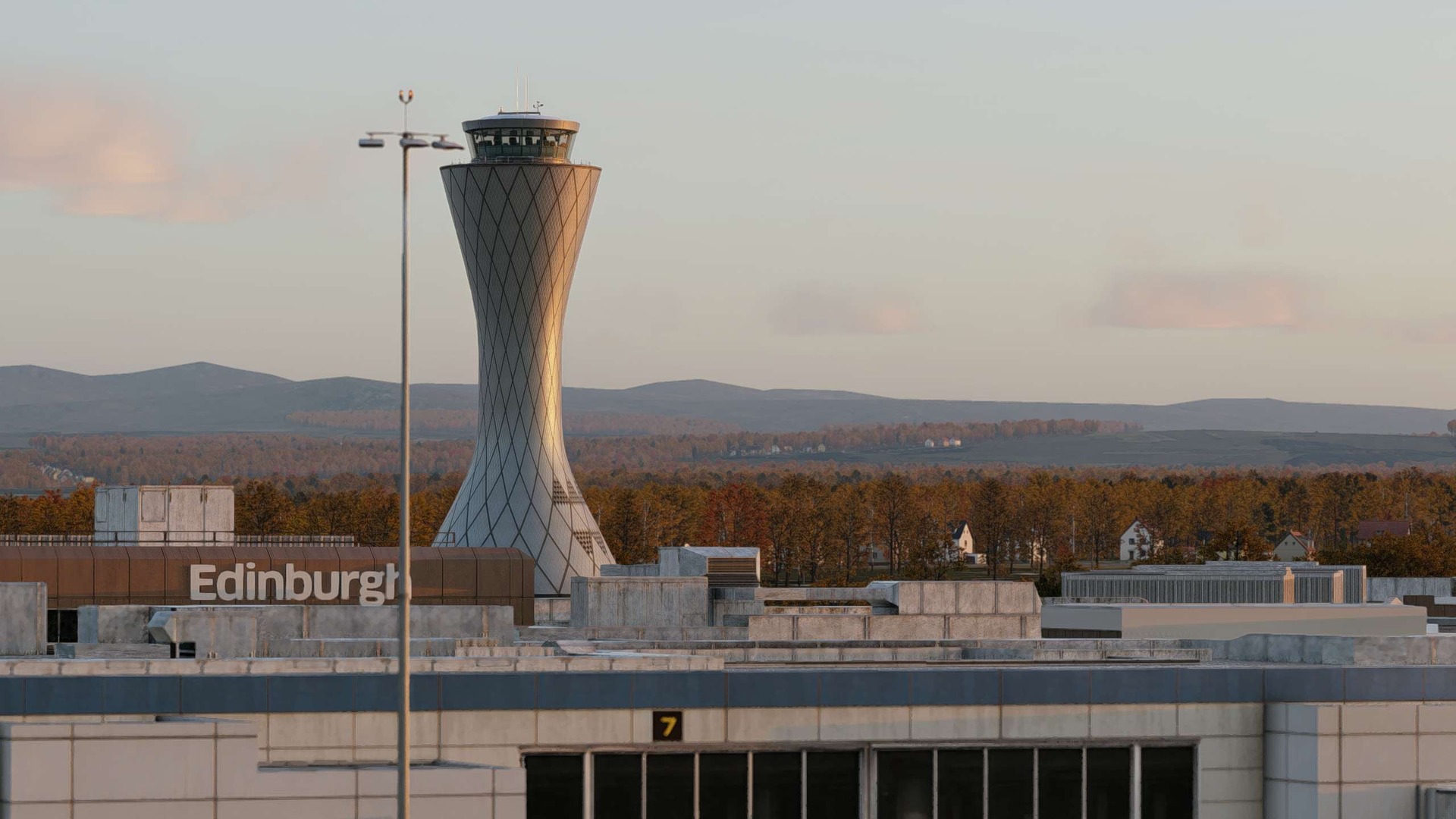 Edinburgh Airport's control tower rising behind the terminal building in HarExperience's EGPH scenery for X-Plane 12, under a pale evening sky.